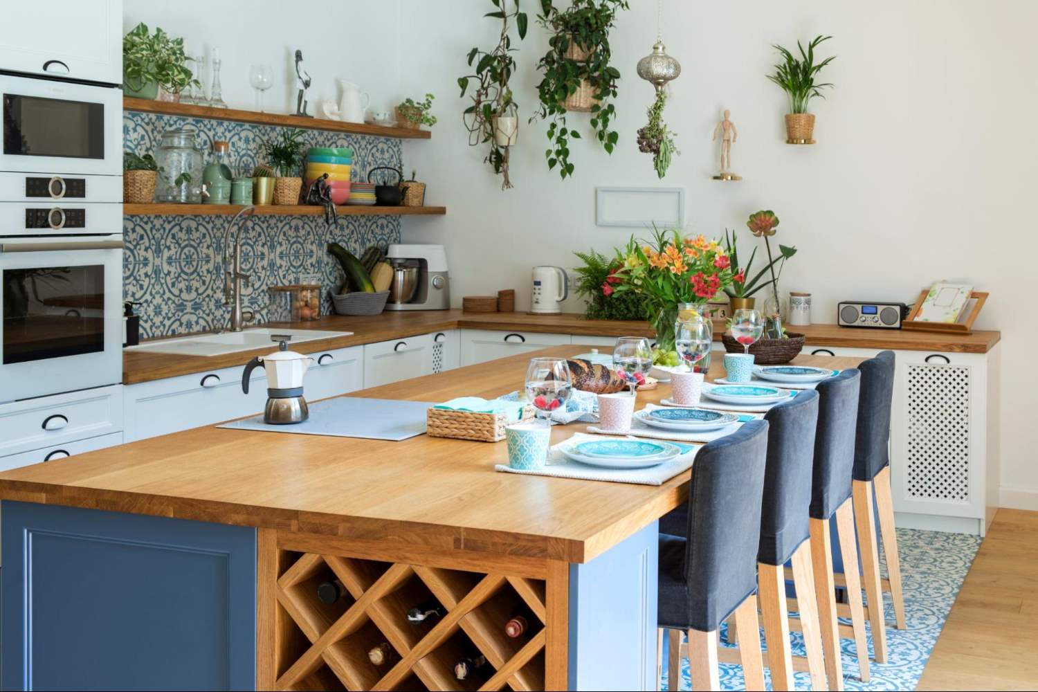 Blue Island with Blue Stools in a Farmhouse Kitchen with Plants