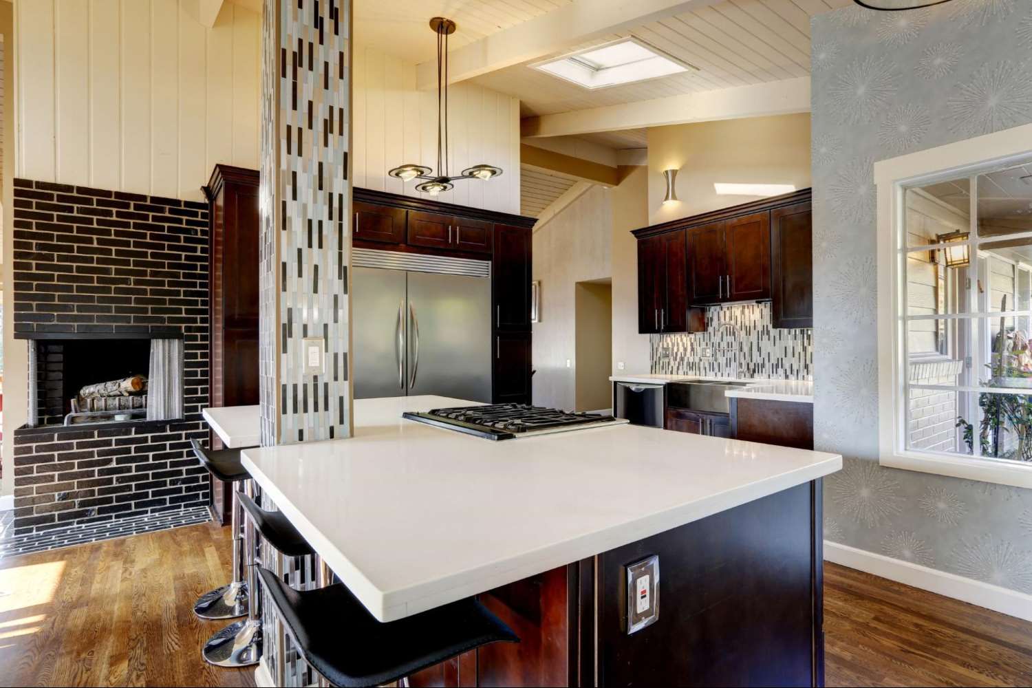 Blue Island with White Countertop and a Column in a Kitchen