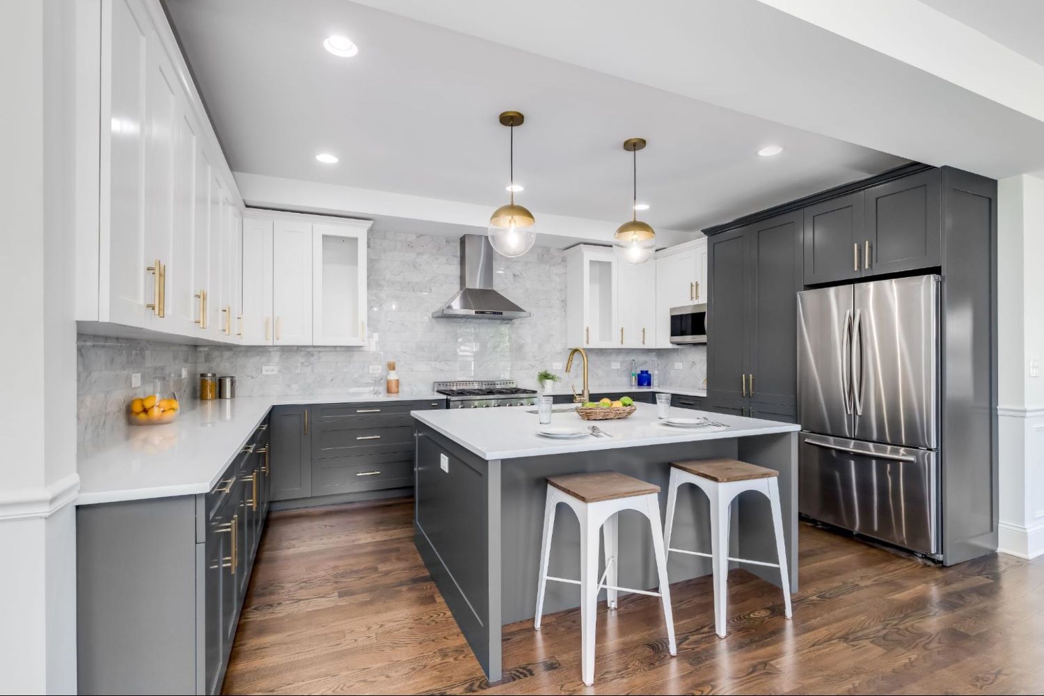 Grey Island with White Countertop and Seating in a Modern Kitchen