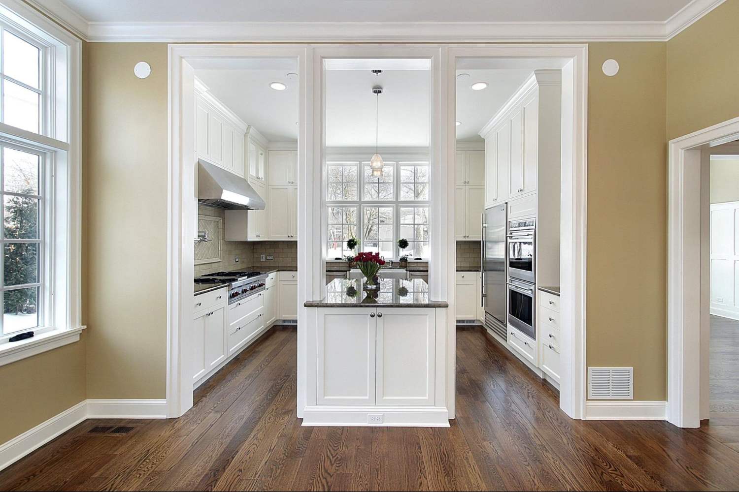 Kitchen Island with 2 Columns on one end in a White Kitchen
