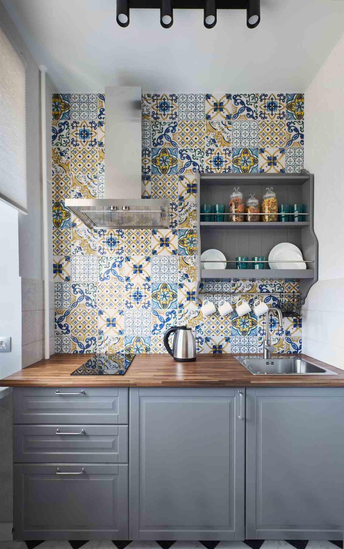 gray and white kitchen with moroccan tiles