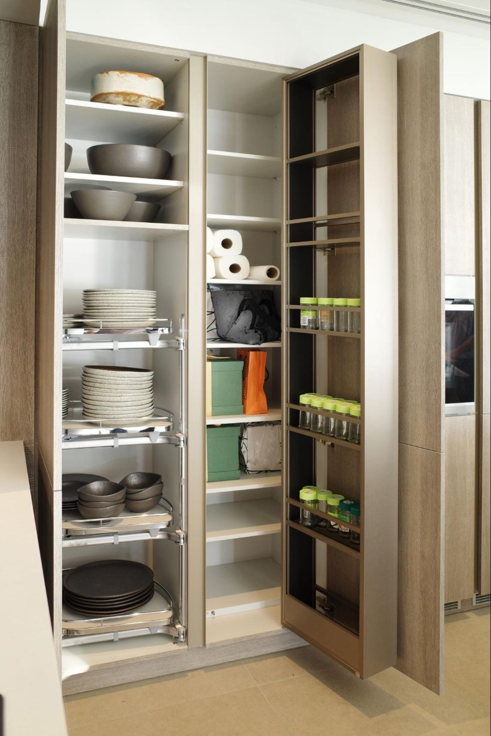 kitchen storage with pullable shelves and a door