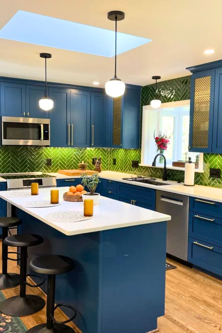 navy kitchen with green backsplash