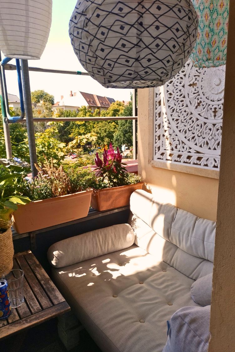 Bright boho nook with paper lantern and floral touches