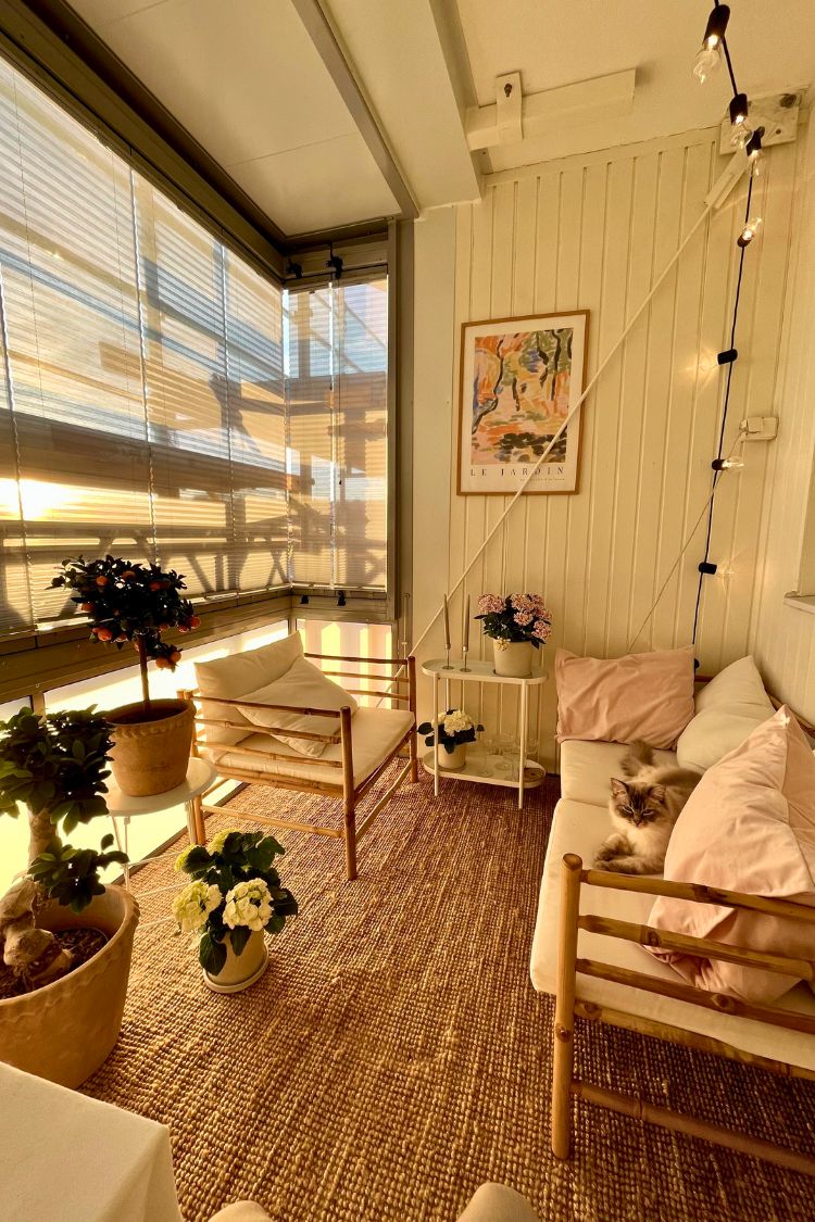 Cream-toned boho setup with string lights and artwork