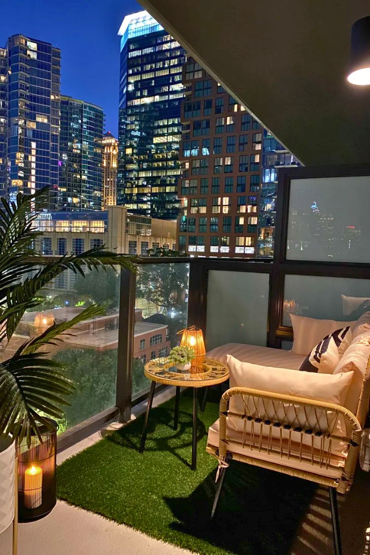 Nighttime boho balcony with city view and rattan seating