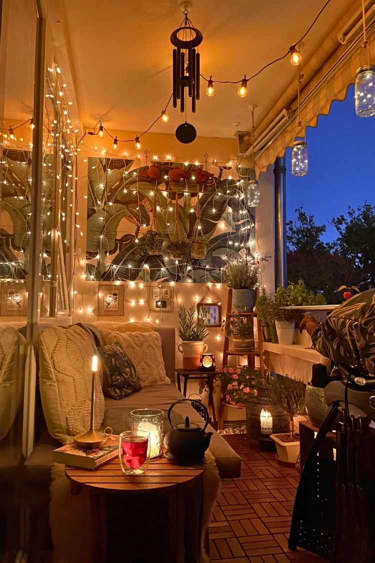 Warm boho setup with hanging lights and small table