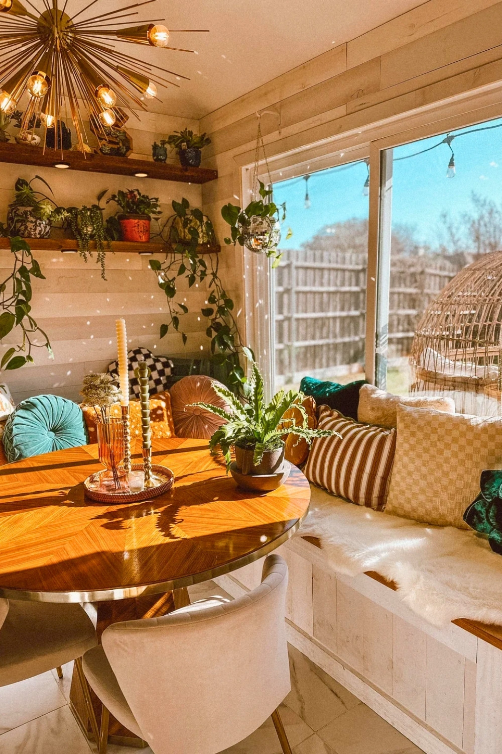 Cozy Boho Kitchen Nook with Round Table and Eclectic Pillows