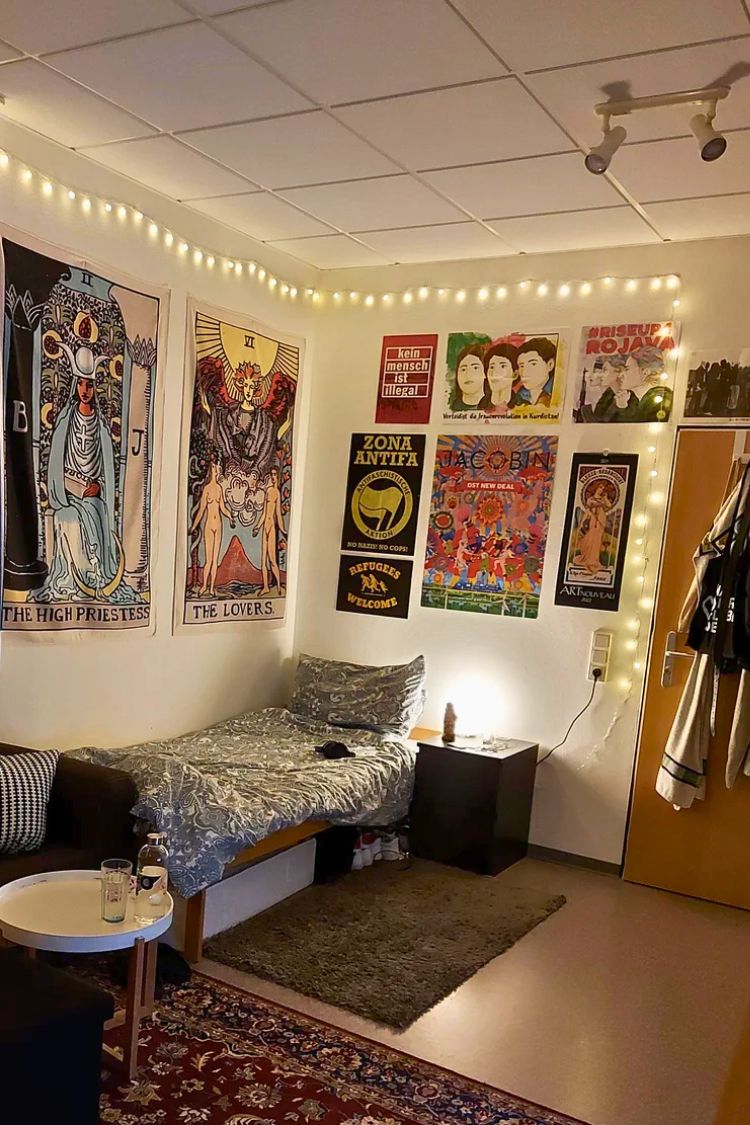guy dorm room with tarot posters