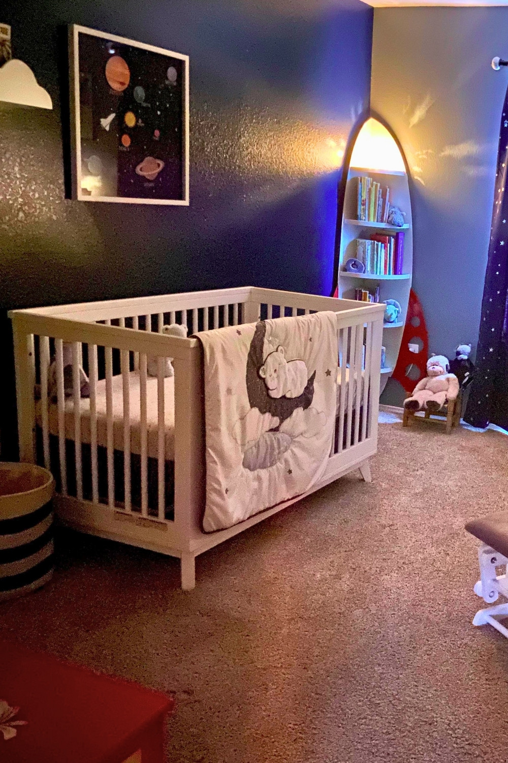 Cozy Space Nursery With Custom Rocket Ship Bookshelf and Starry Decor