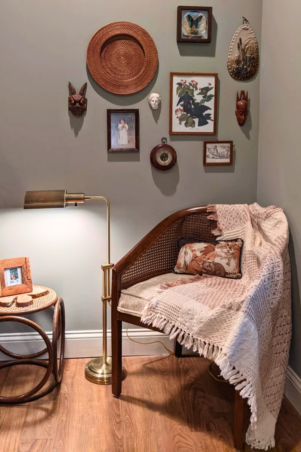 Earthy Bedroom Corner with Thrifted Cane-Back Chair and Gallery Wall