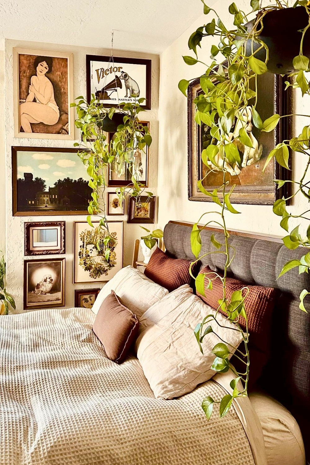 Earthy Bedroom Gallery Wall With Hanging Plants