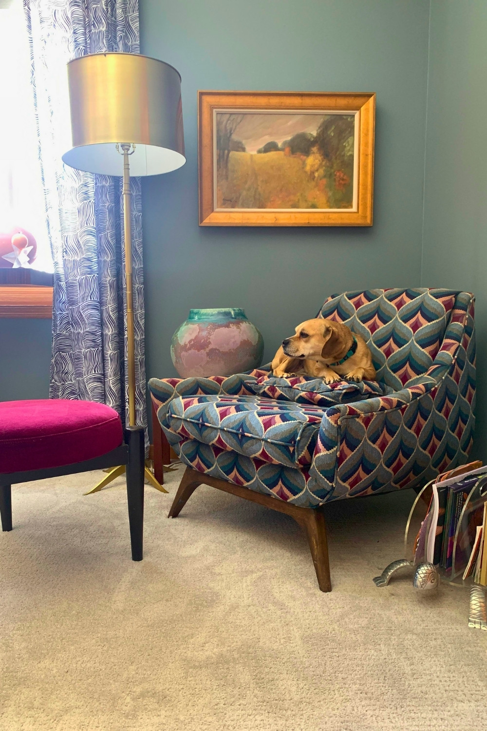 Thrifted Bedroom Corner with Patterned Chair and Cozy Dog