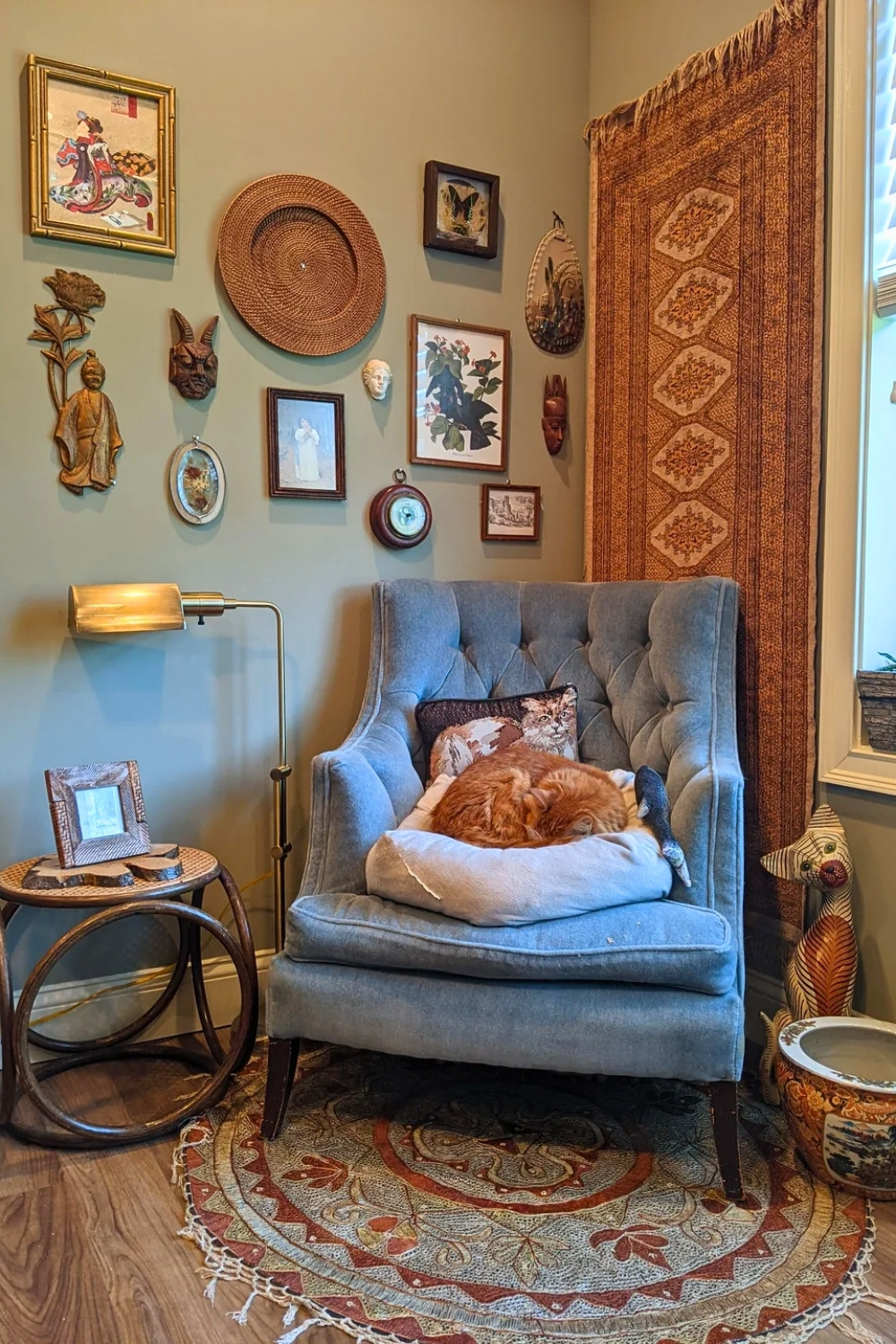 Vintage-Inspired Small Sitting Area with Blue Chair and Cat
