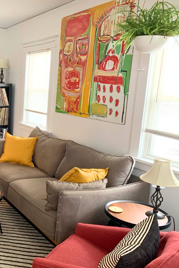basquiat art above the couch