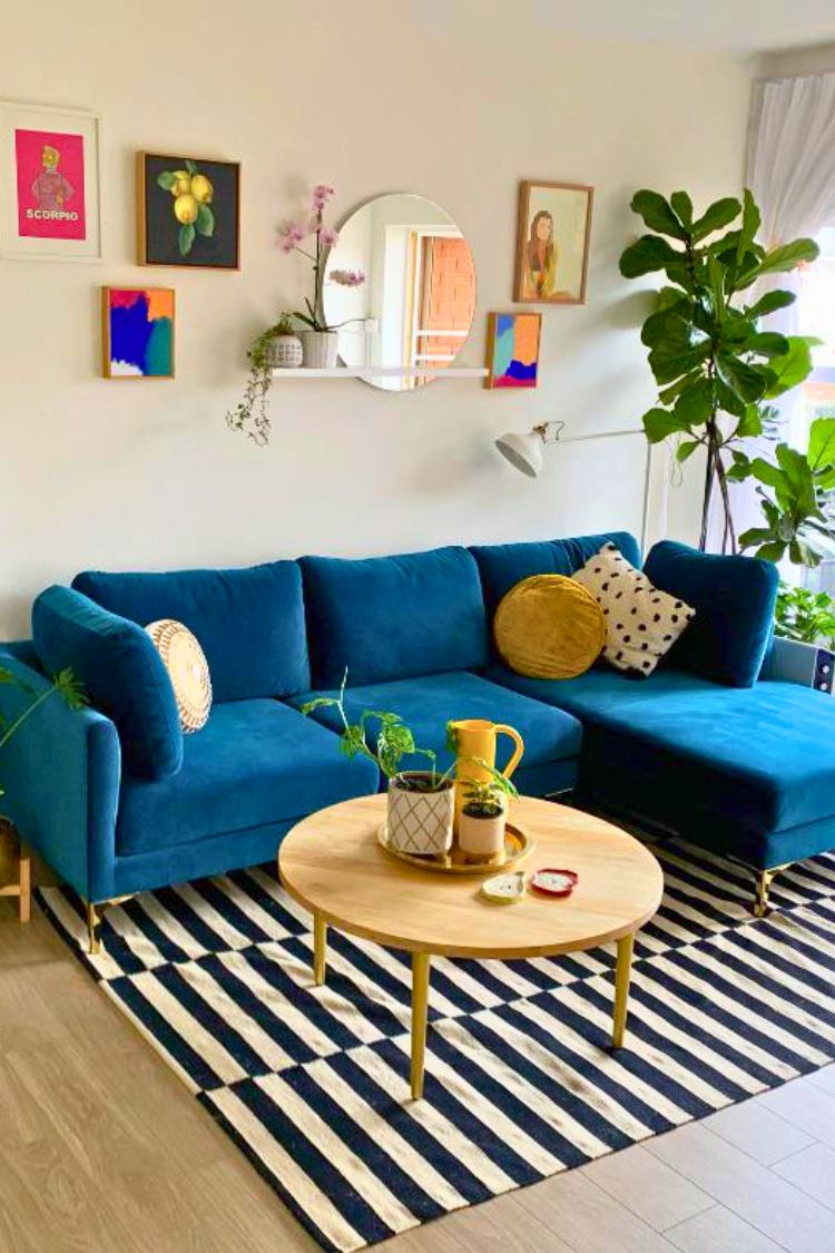 mirror and arts above the couch