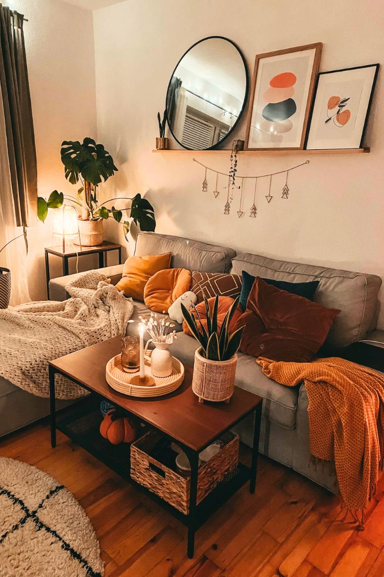 mirror and arts above the couch