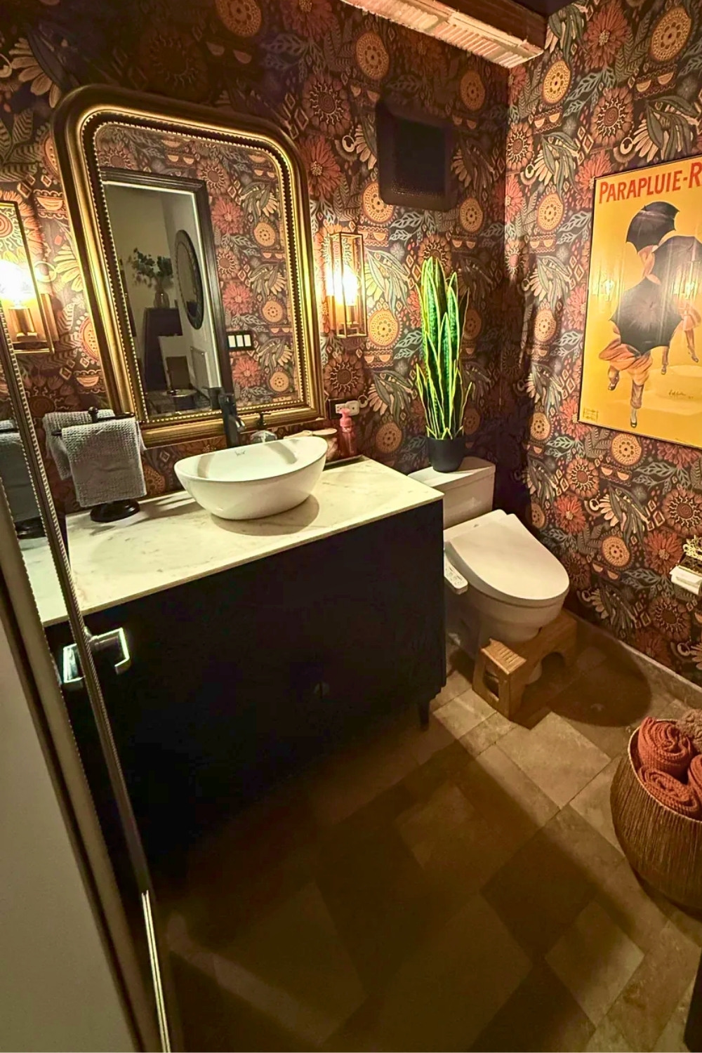 Bold Guest Bathroom With Dark Floral Wallpaper And Gold Mirror