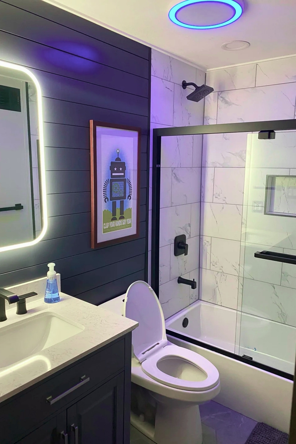 Modern Guest Bathroom With Robot Print And LED Mirror