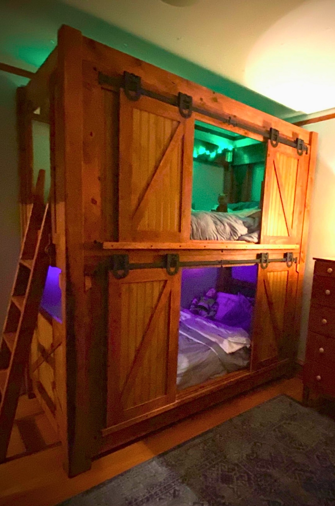 Rustic barn-style bunk bed with LED lighting