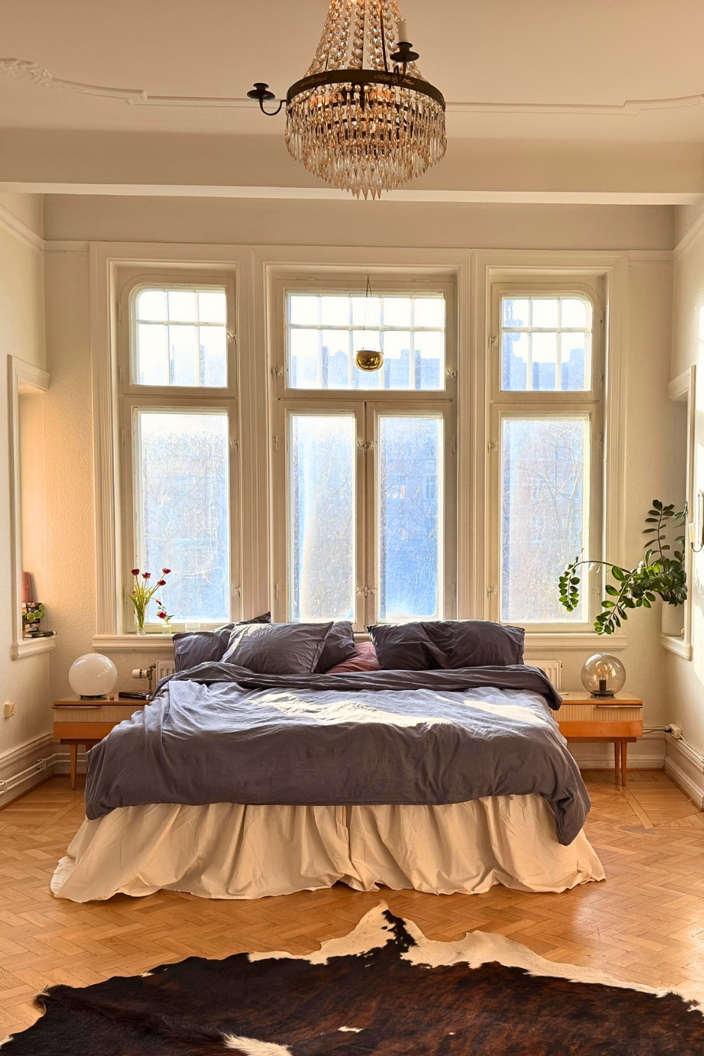 Sunlit Winter Bedroom With Herringbone Floor and Elegant Decor