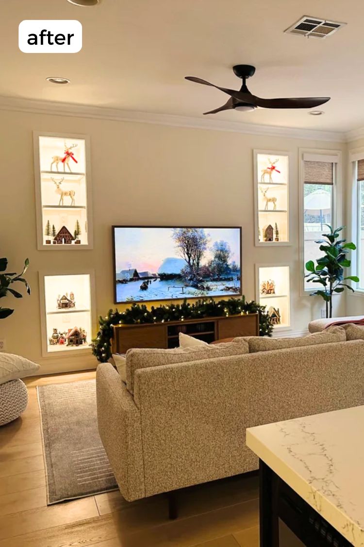 A bright, modern living room with built-in shelves framing the TV