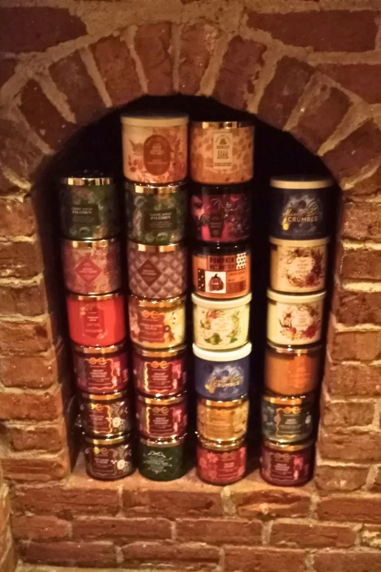 Arched brick fireplace used as a display for stacked vintage books