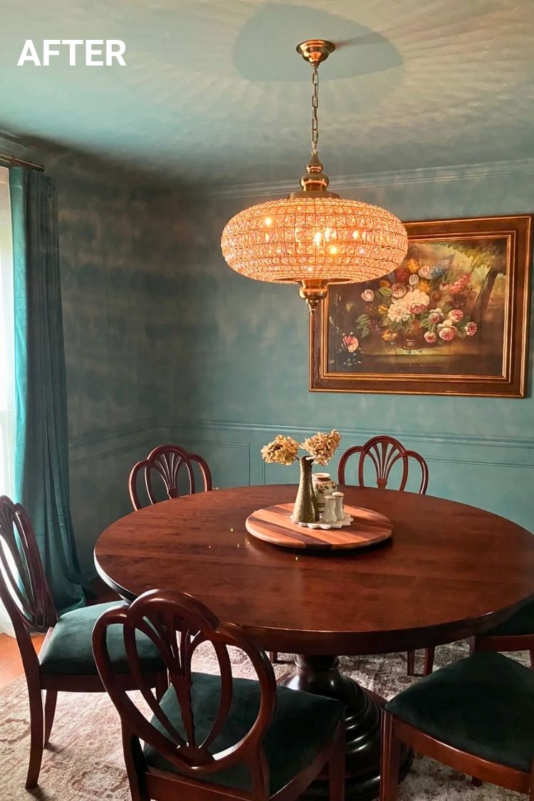 After – Dark teal walls and round wooden table