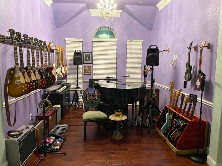 cozy neat music room with lavender wall