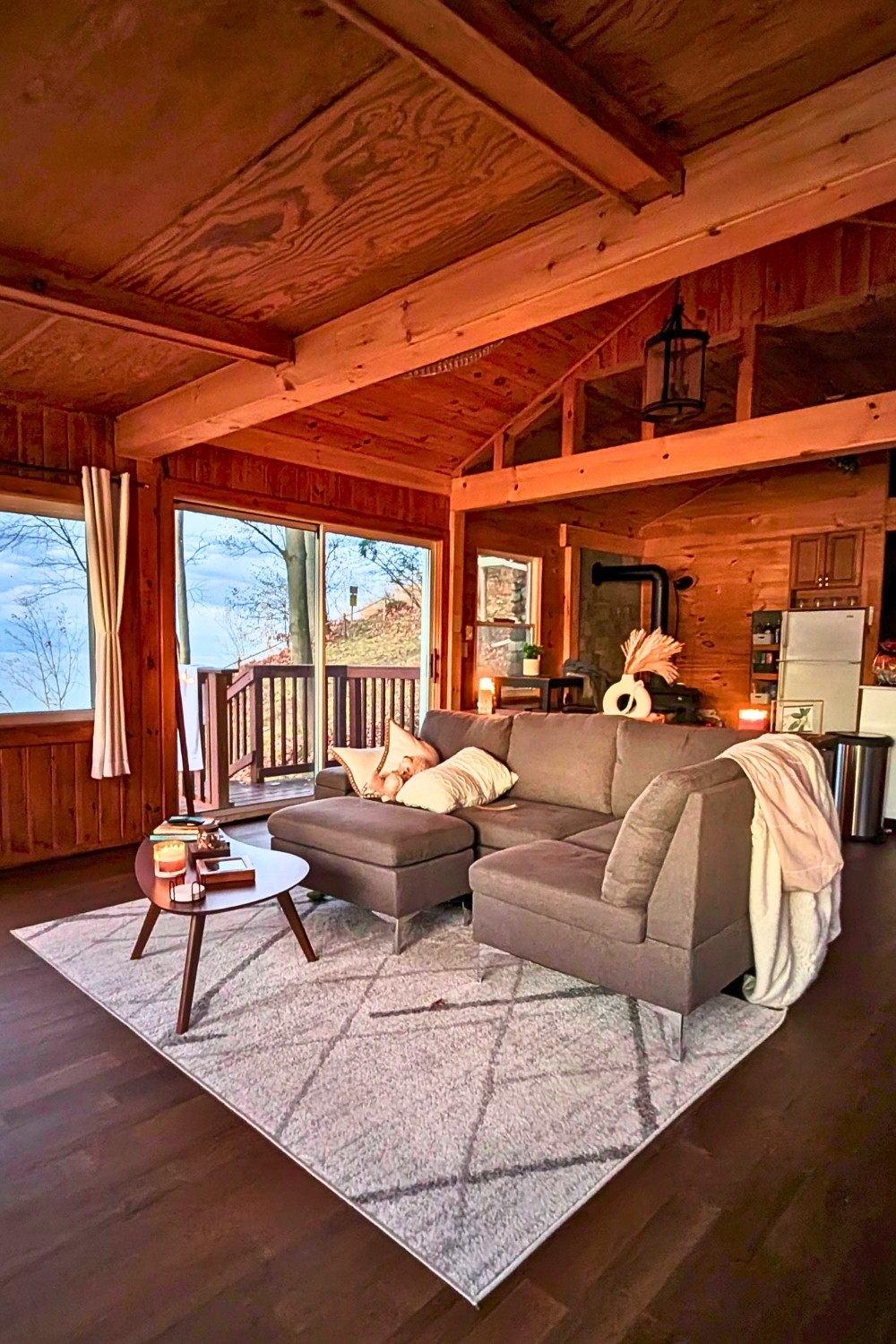 Cozy Living Room in a 100-Year-Old Cabin With Modern Aesthetic and Wood Elements
