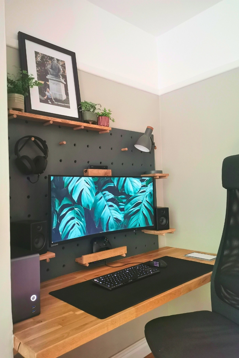 Cozy Minimal Pegboard Desk With Oak Wood Shelves In Small Room
