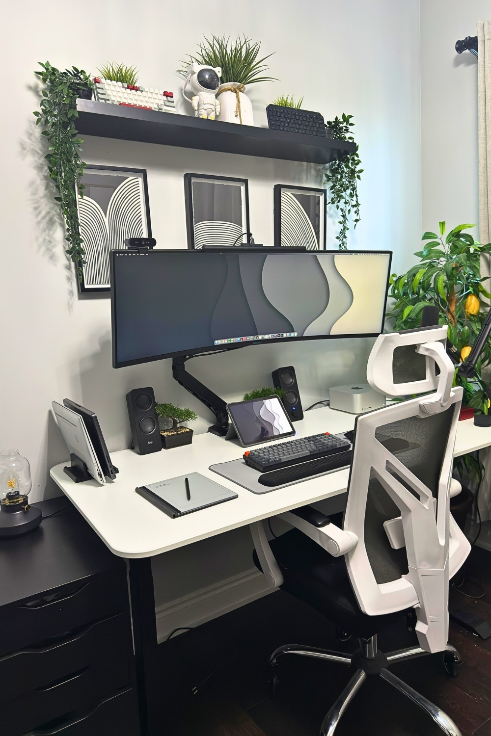 Minimalist Black And White Tech Desk With Ultra-Wide Monitor And Green Accents