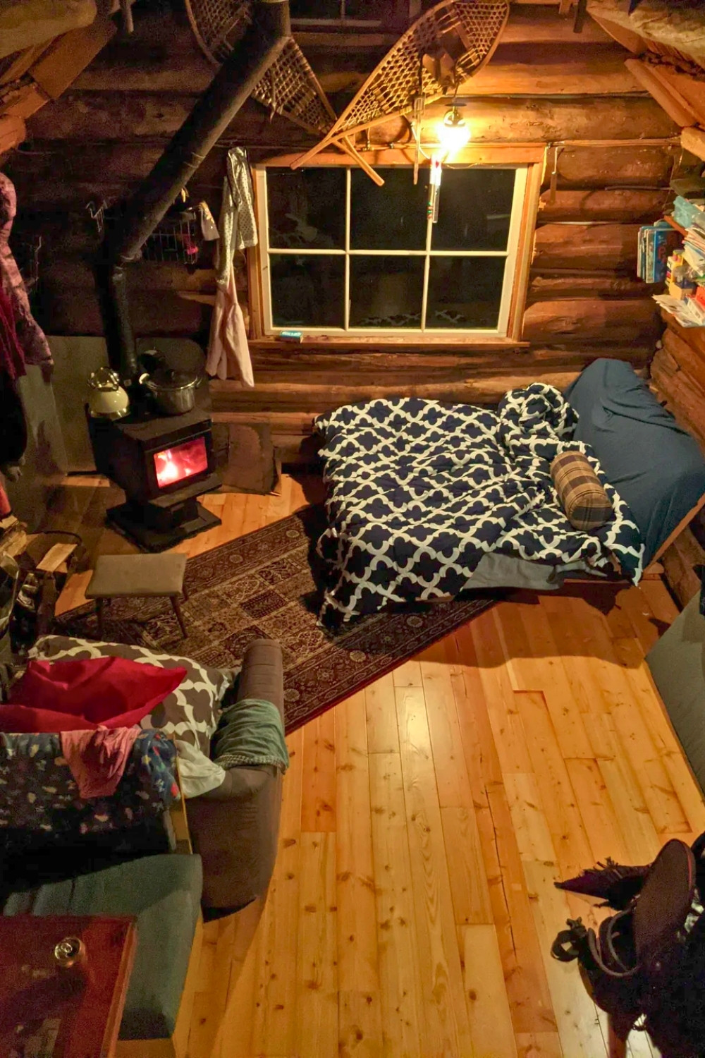 Rustic Cabin Living Room With Wood Stove and Refinished Fir Floors