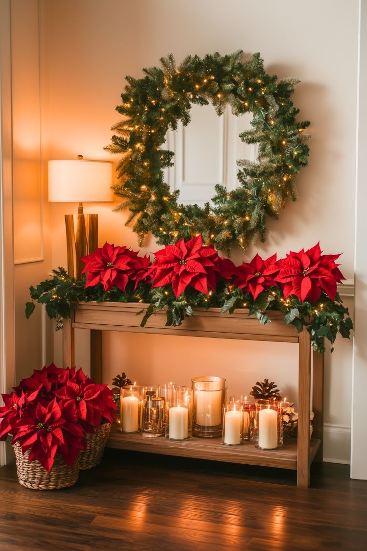 Festive Front Entrance Table With Garland, Poinsettia Decorations, and Large Christmas Wreath
