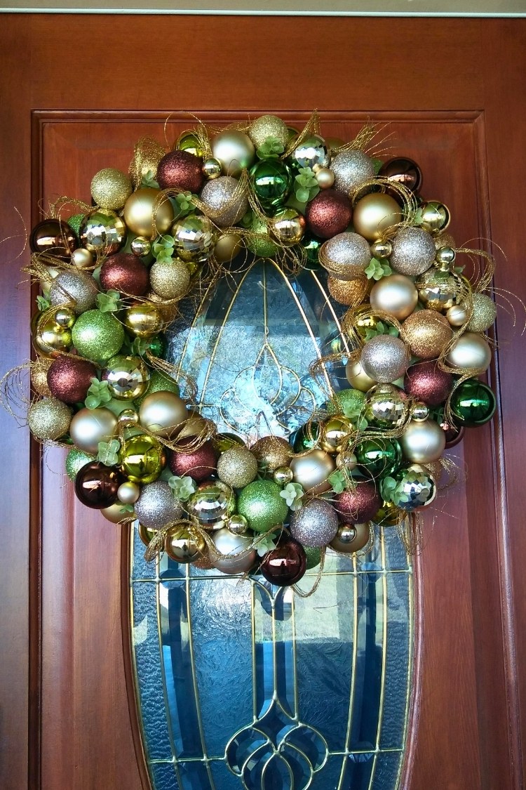 a diy christmas wreath on front door