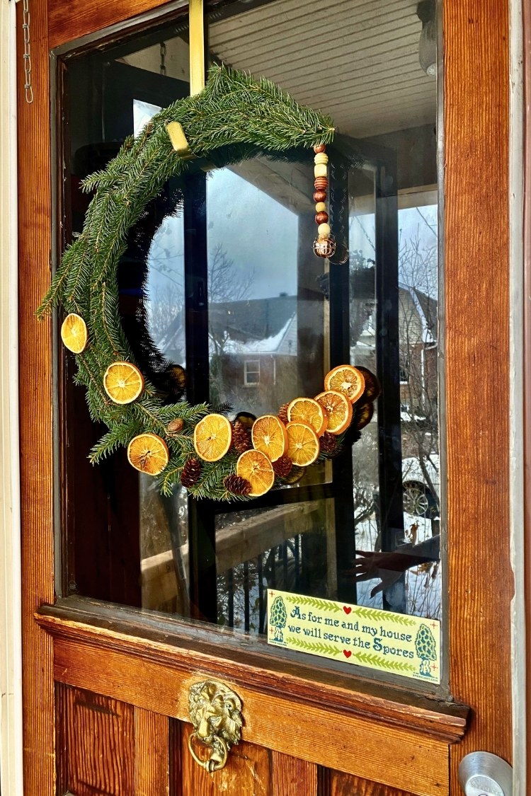 a diy christmas wreath on front door