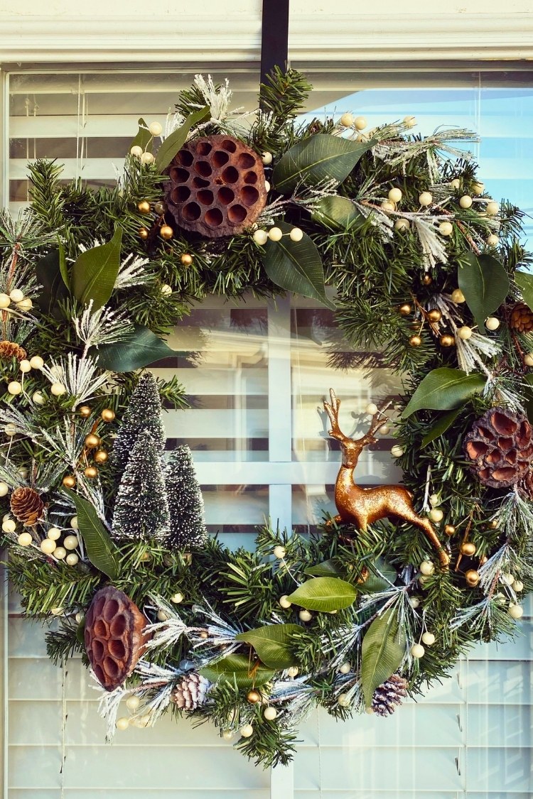 a diy christmas wreath on front door